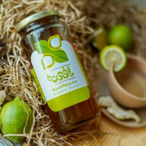 Close-up of organic honey jar with dried lime and natural elements for authentic feel.